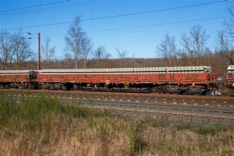 Vierachsiger Drehgestell Flachwagen Mit Seiten Und Stirnwandklappen