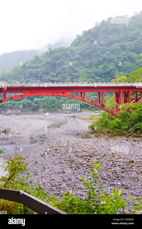 Vertical picture of red bridge in Taiwanese Taroko National Park ...