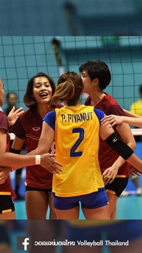 The Volleyball Team Is Congratulating Each Other After Their Victory