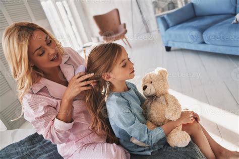 Perfect Hairdresser Top View Of Beautiful Young Mother Brushing Her