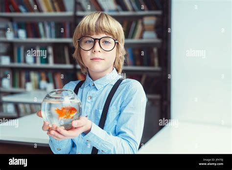 Boy With Goldfish Stock Photo Alamy