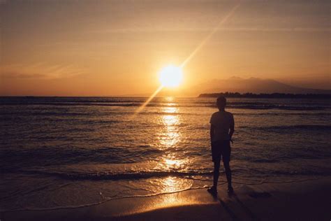 Man Beach Sunset Mountains Royalty Free Photo