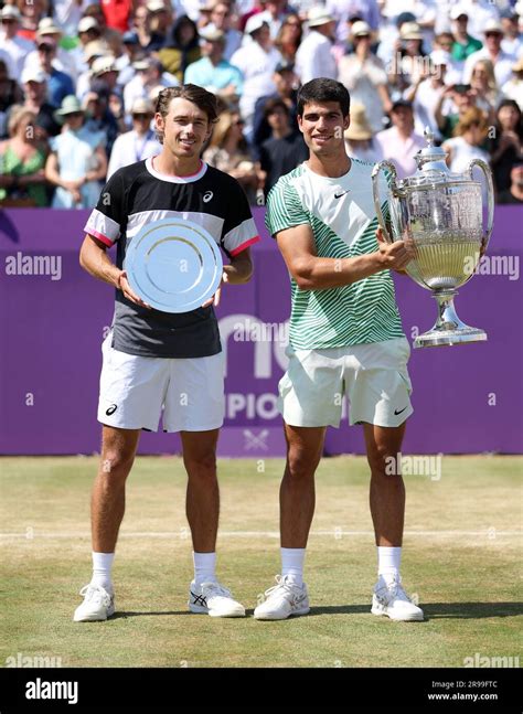 Runner-up Alex de Minaur and winner Carlos Alcaraz pose with their ...