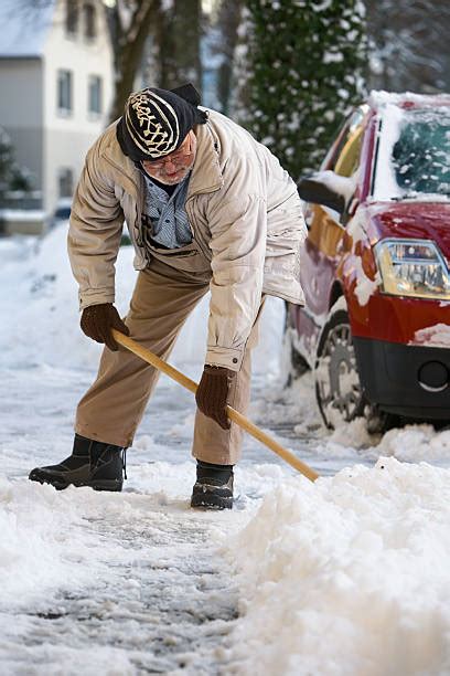 Old Man Shoveling Snow Stock Photos Pictures And Royalty Free Images