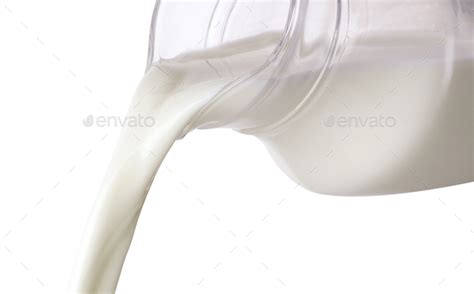 Pouring Milk From Jug Isolated On White Background Stock Photo By Xamtiw