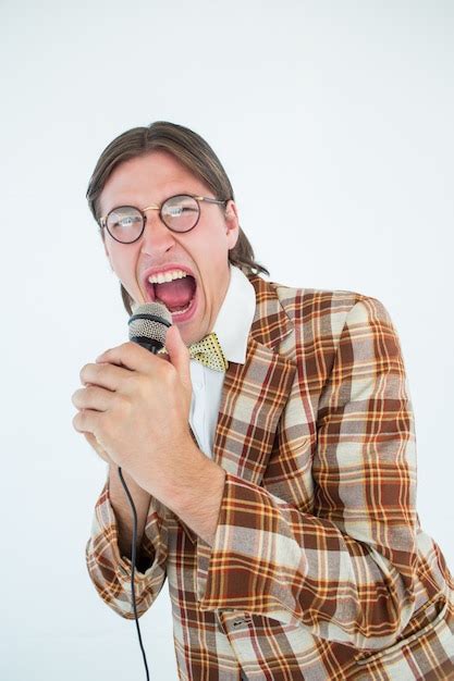 Premium Photo Happy Geeky Hipster Singing With Microphone