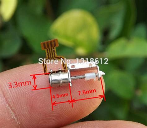 An Image Of A Tiny Device That Is In The Palm Of Someone S Hand