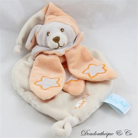 Doudou Plat Chien Baby Nat Luminescent Orange Blanc Toile Bn