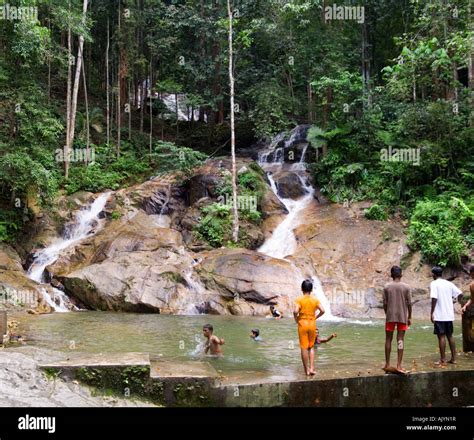 Children Playing In Pool At Bottom Of Waterfall In Kanching Park Kuala