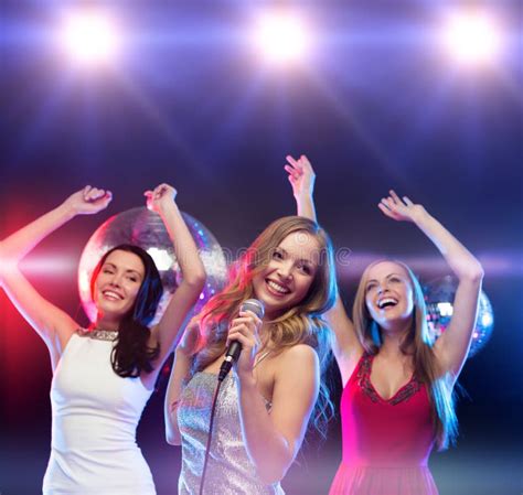 Three Smiling Women Dancing And Singing Karaoke Stock Image Image Of