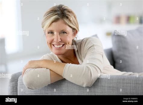 Beautiful 40 Year Old Woman Relaxing In Sofa Stock Photo Alamy