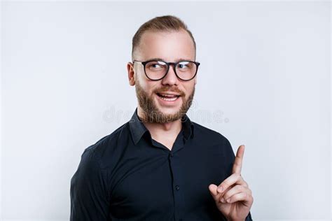 Happy Young Bearded Man In Eyeglasses Looking At Camera Stock Image