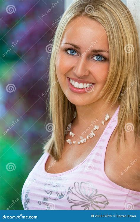 Portrait Of Young Woman With Blue Eyes And Perfect Teeth Stock Image