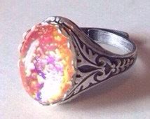 Popular items for harlequin opal ring on Etsy