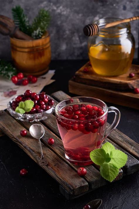 Cranberry Juice With Honey In A Cup Cranberries In Sugar On A Dark