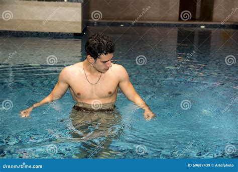 Young Man Relaxing In Swimming Pool Stock Image Image Of Muscles