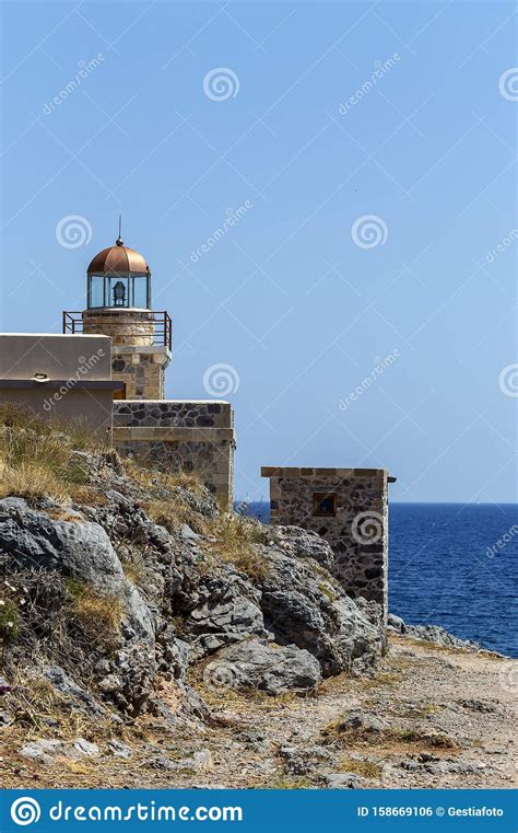 Lighthouse Near The City Monemvasia Against The Background Of The Sea