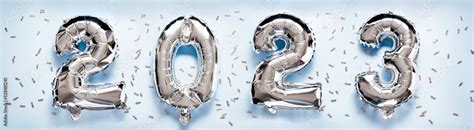 2023 New Year Celebration - silber numbers on light blue glitter ...