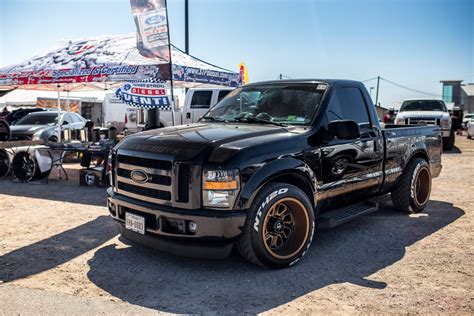 a black truck parked in front of a tent