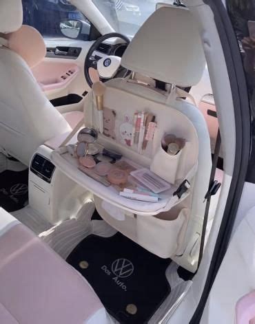 The Inside Of A Car With Its Door Open And Various Items In It S