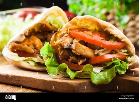 Doner Kebab Fried Chicken Meat With Vegetables In Pita Bread Stock