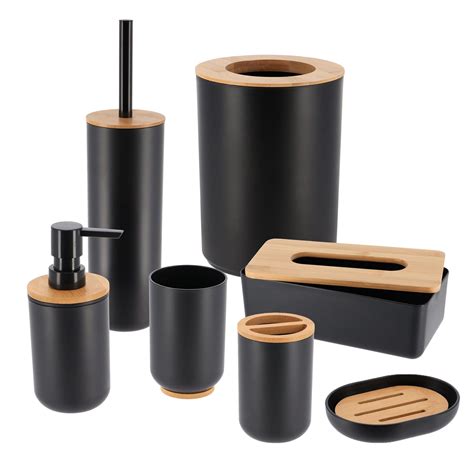 The Bathroom Accessories Are Black And Wood