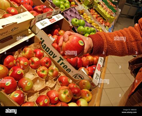 Person Consumer Shopping In Supermarket In Department For Fruit With