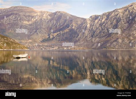 View Of Risan With Boat And Dramatic Reflections Kotor Bay Montenegro