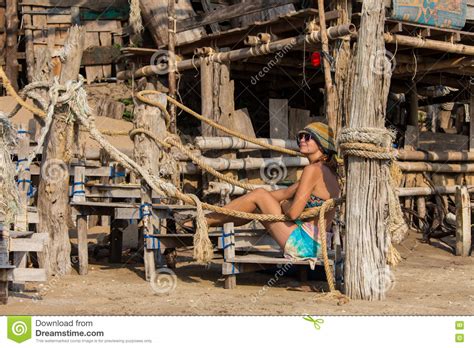 Woman In Yellow Bikini Lying On Tropical Beach At Seychelles Stock