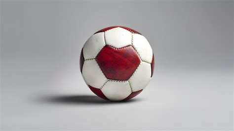 Premium Ai Image A Red And White Soccer Ball With A White And Black