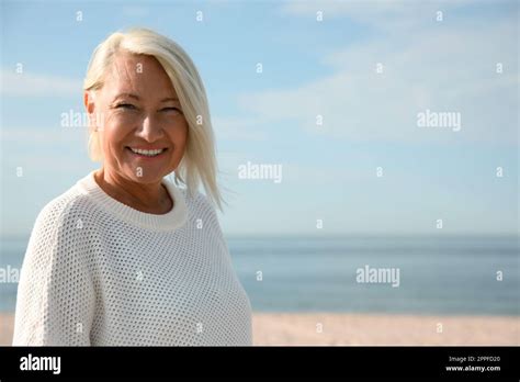 Beautiful Mature Woman On Sea Beach In Summer Stock Photo Alamy