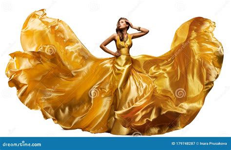 Woman In Fluttering Gold Dress On White Waving Silk Cloth Artistic