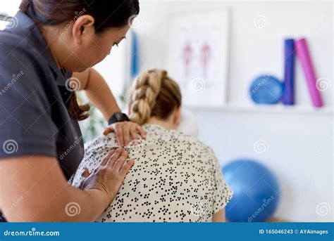 Chinese Woman Massage Therapist Giving A Neck And Back Pressure Stock Image Image Of