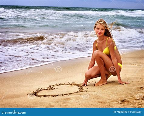 Summer Girl Sea Girl In Swimsuit Write On Sand Heart Shape Stock Photo