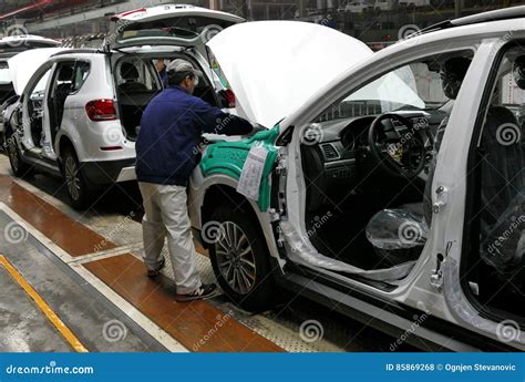 Workers Assemble A Car On Assembly Line In Car Factory Editorial Stock