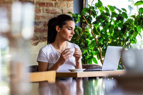 Young Businesswoman Is Working In A Cafeteria In Her Break Woman