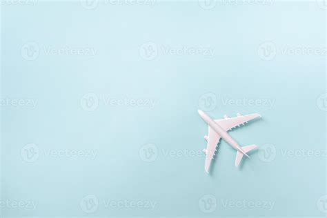 White plane, airplane on blue pastel color background with copy space ...