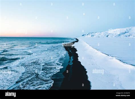 Overhead Aerial Shot of Beautiful Black Beach in Iceland in Winter with Snow Stock Photo - Alamy