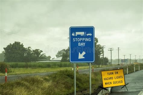 Roadside Highway Warning Signs On Wet Rainy Day With Low Visibility