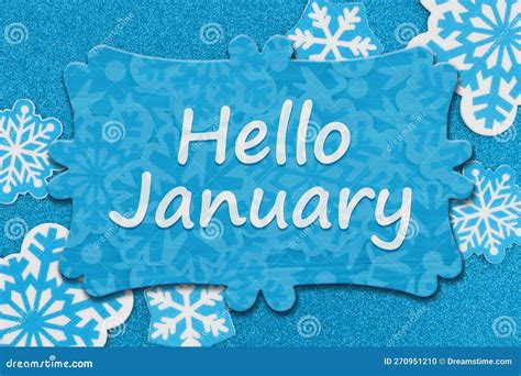 Hello January Message On Wood Sign On Snowflakes On Blue Glitter Paper