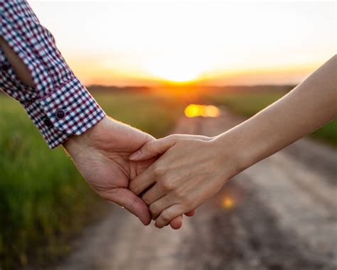 Premium Photo | Love concept. a couple holding hand during sunset, a ...