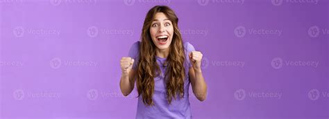 Cheerful hopeful cute female fan celebrating awesome news winning