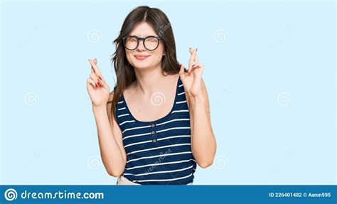 Young Beautiful Caucasian Girl Wearing Casual Clothes And Glasses