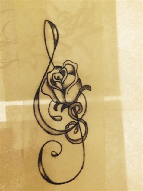 Treble Clef Tattoo With Rose