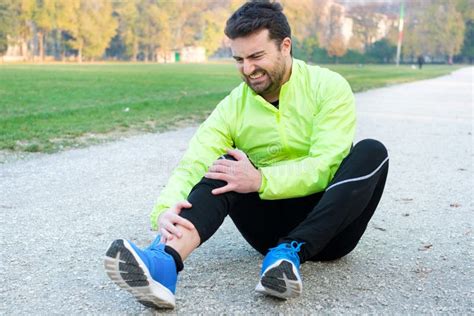 Male Athlete Suffering From Pain In Leg While Exercising Outdoor Stock Image Image Of Hurt