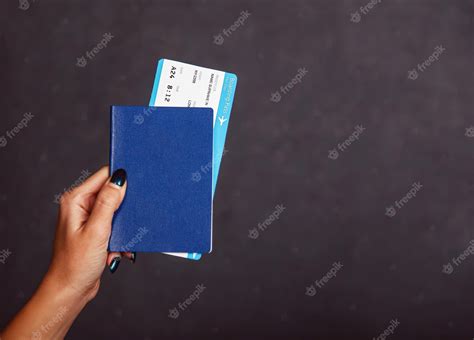 Premium Photo Womans Hand Holding International Passport Airplane