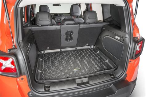 The Back End Of An Orange Minivan With Its Cargo Compartment Open And