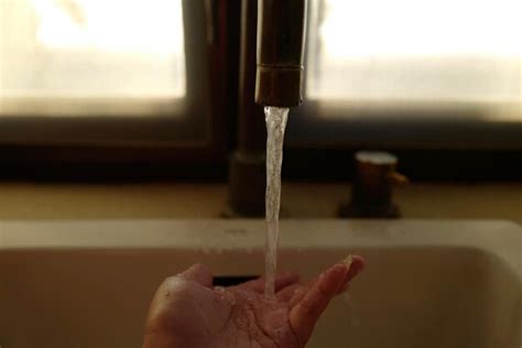 Premium Photo Close Up Of Person Washing Hands Under Faucet In Sink