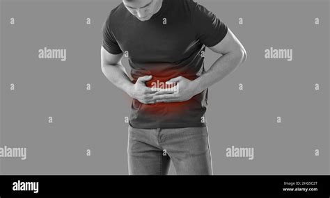 Man Experiences Abdominal Cramps And Stomach Pain With Food Poisoning