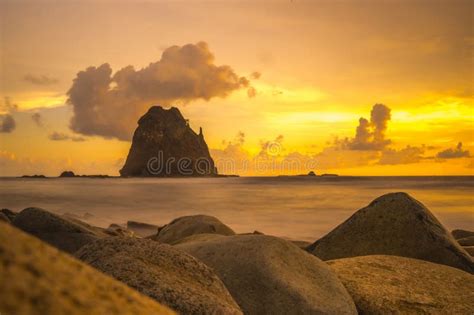 Sunset at the Rocky Beach in Papuma, Jember, East Java, Indonesia Stock ...